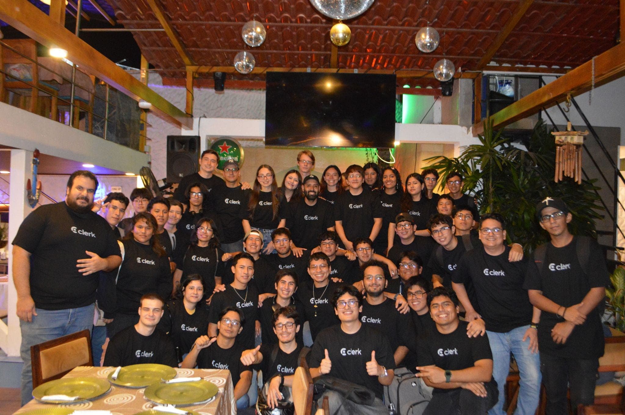 Group photo of attendees in Clerk T-shirts