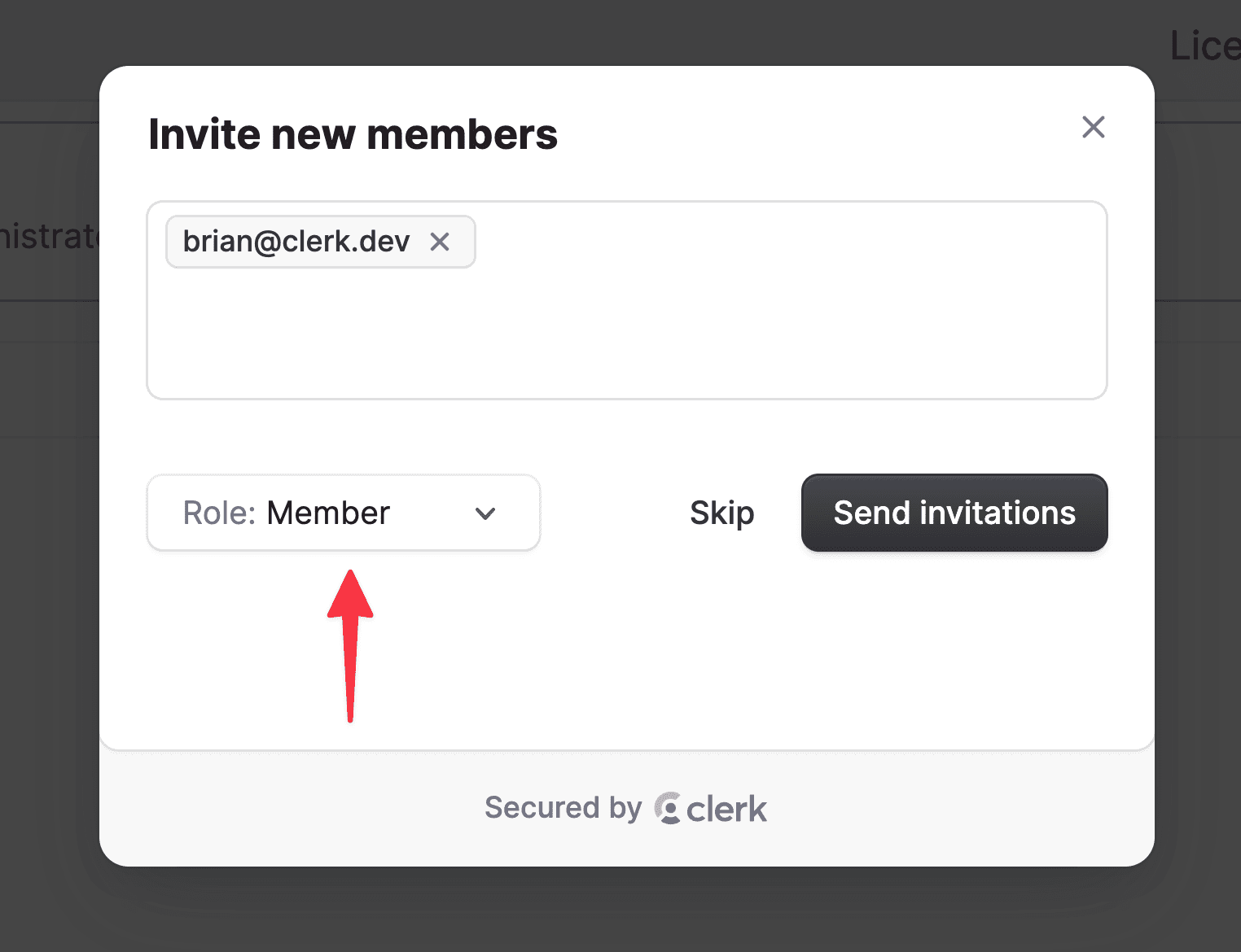 The Clerk user invite modal with brian@clerk.dev populated in the text area and a red arrow pointing to a dropdown showing the Admin role selected.